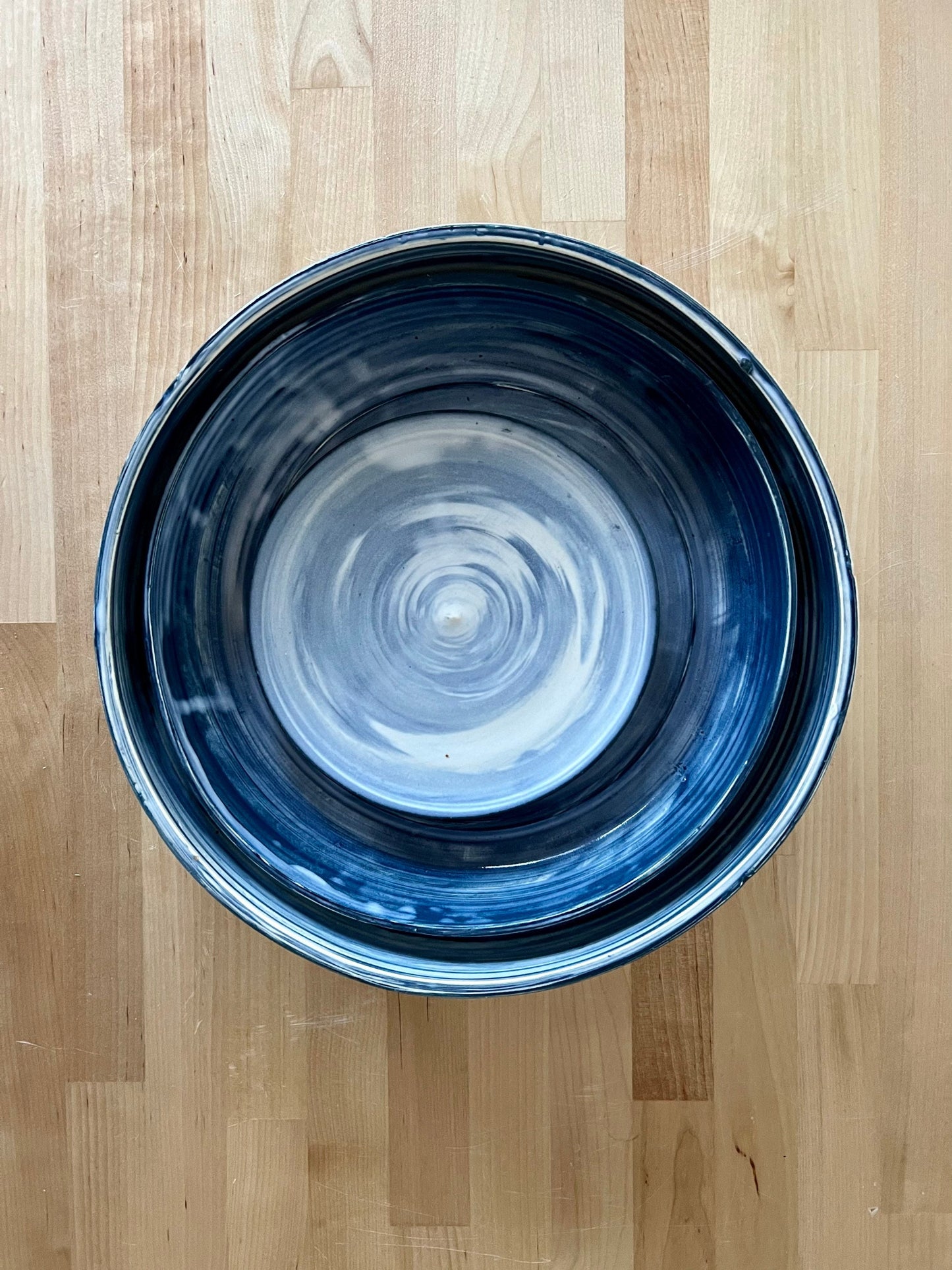 limited edition. plates and blates. mixed and marbled white and blue clay. kitchenware. handmade ceramic