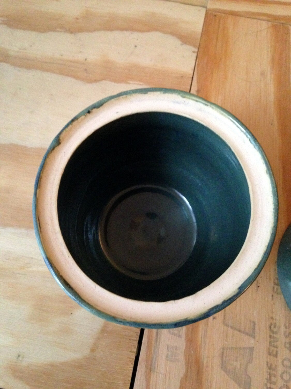 blue green medium sized lidded ceramic jar with free hand sugar skull carving