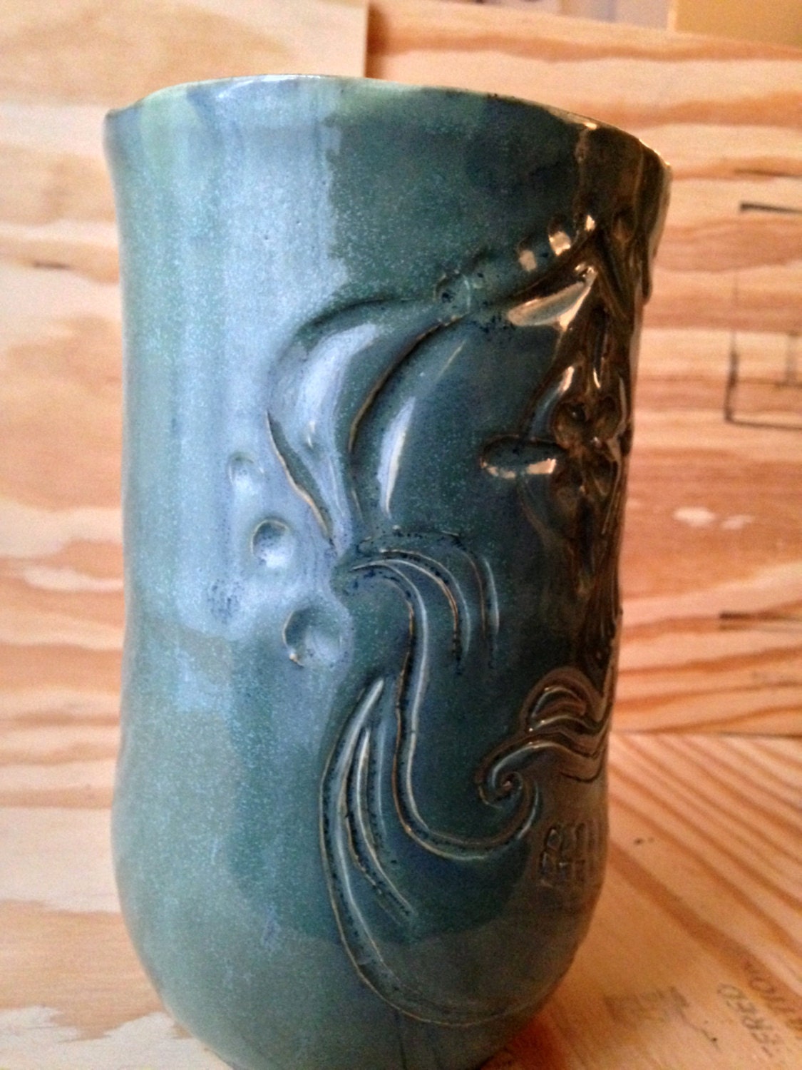 Unique blue green ceramic vase with sugarskull carving