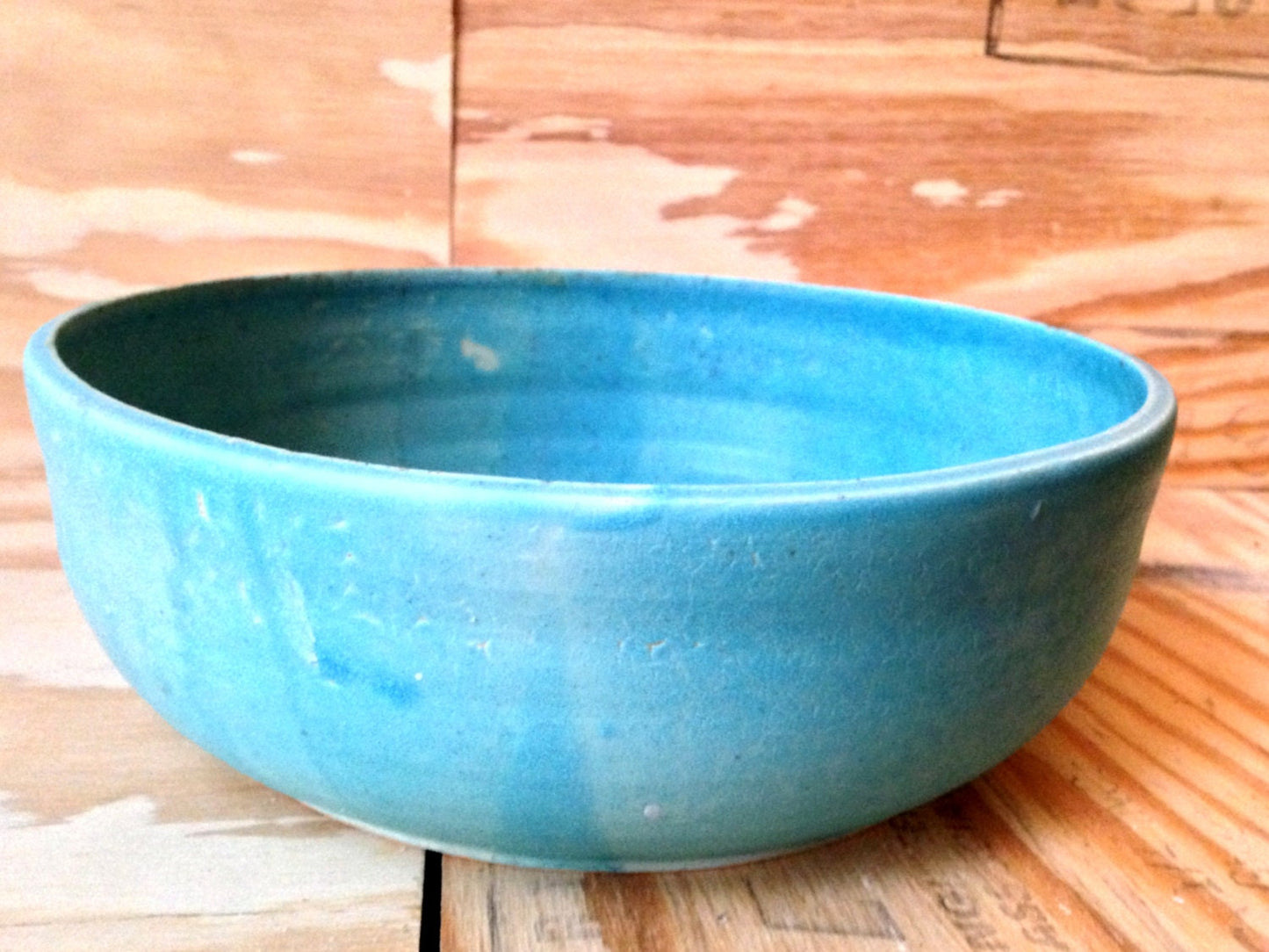 Large turquiose ceramic bowl with freehand sugar-skull carving