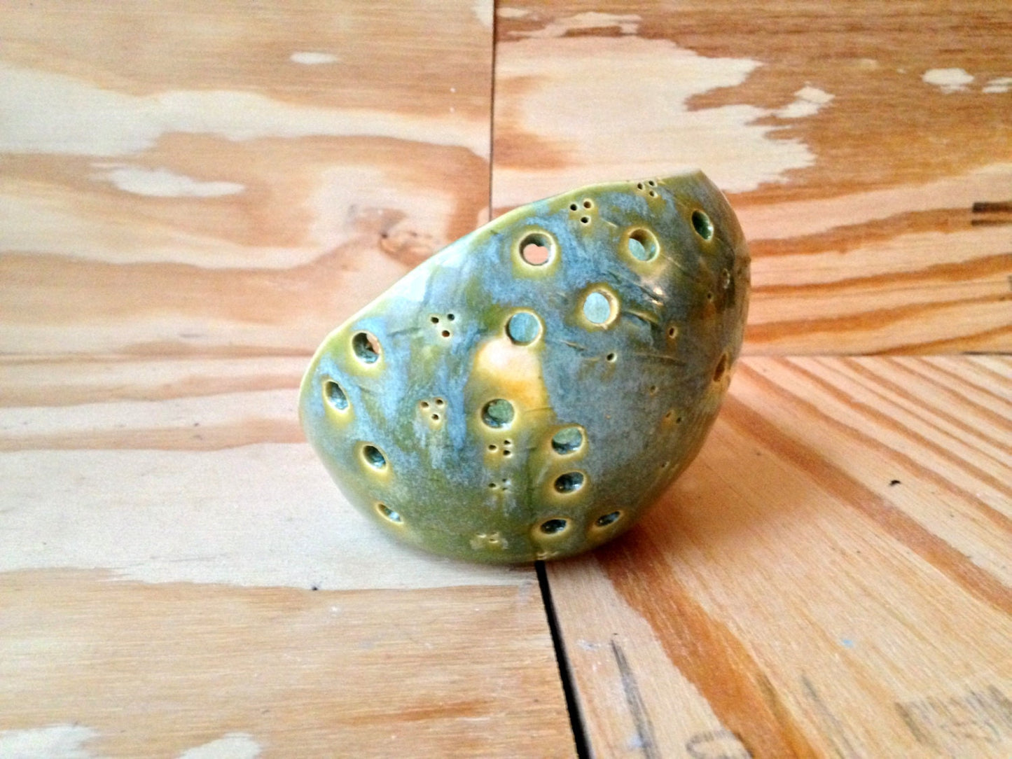 handemade ceramic green candle holder with circle pattern
