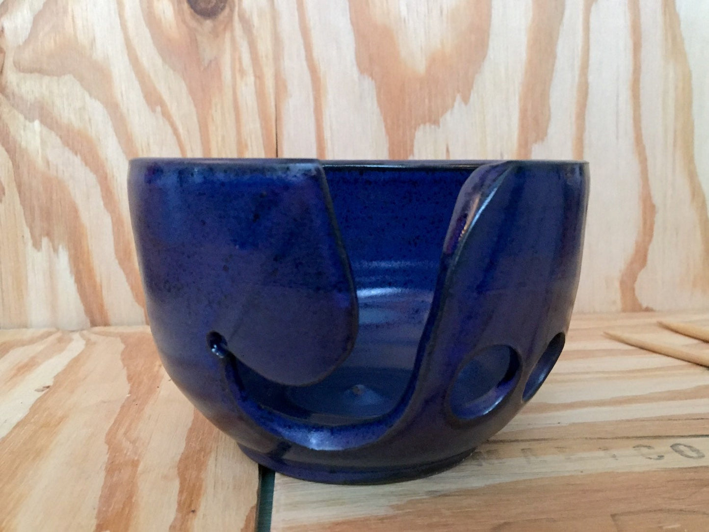 Handmade ceramic yarn/knitting bowl with hand cut pattern in cobalt blue