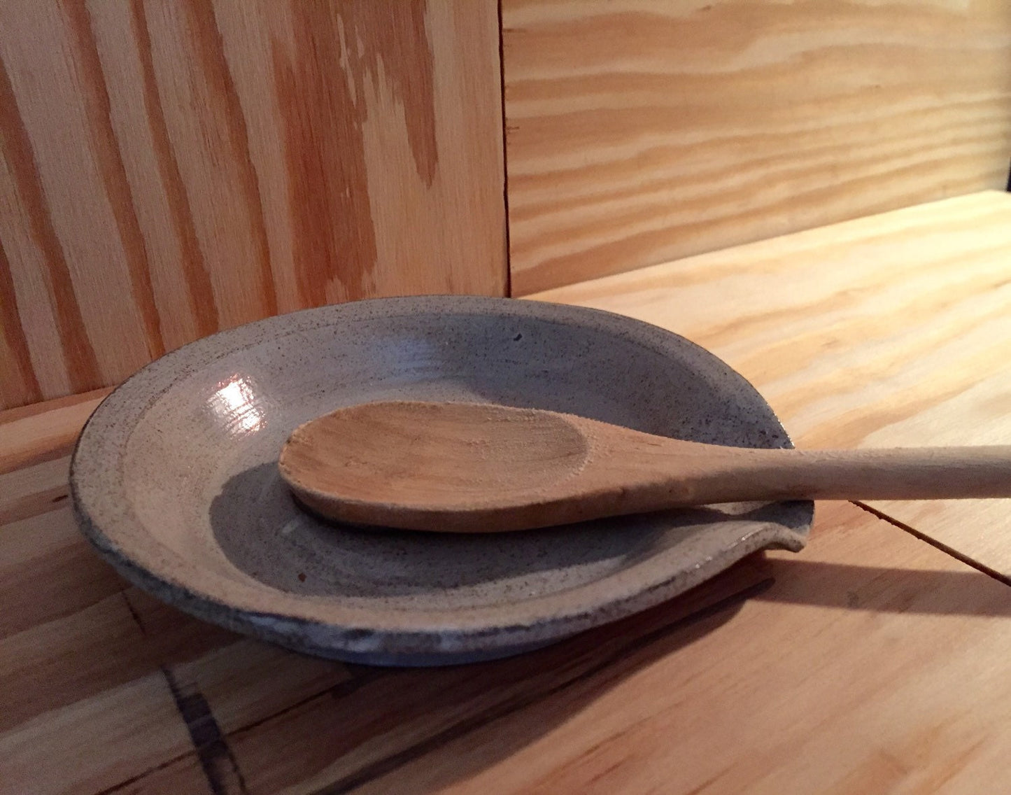 White handmade ceramic spoon rest with sugarskull design