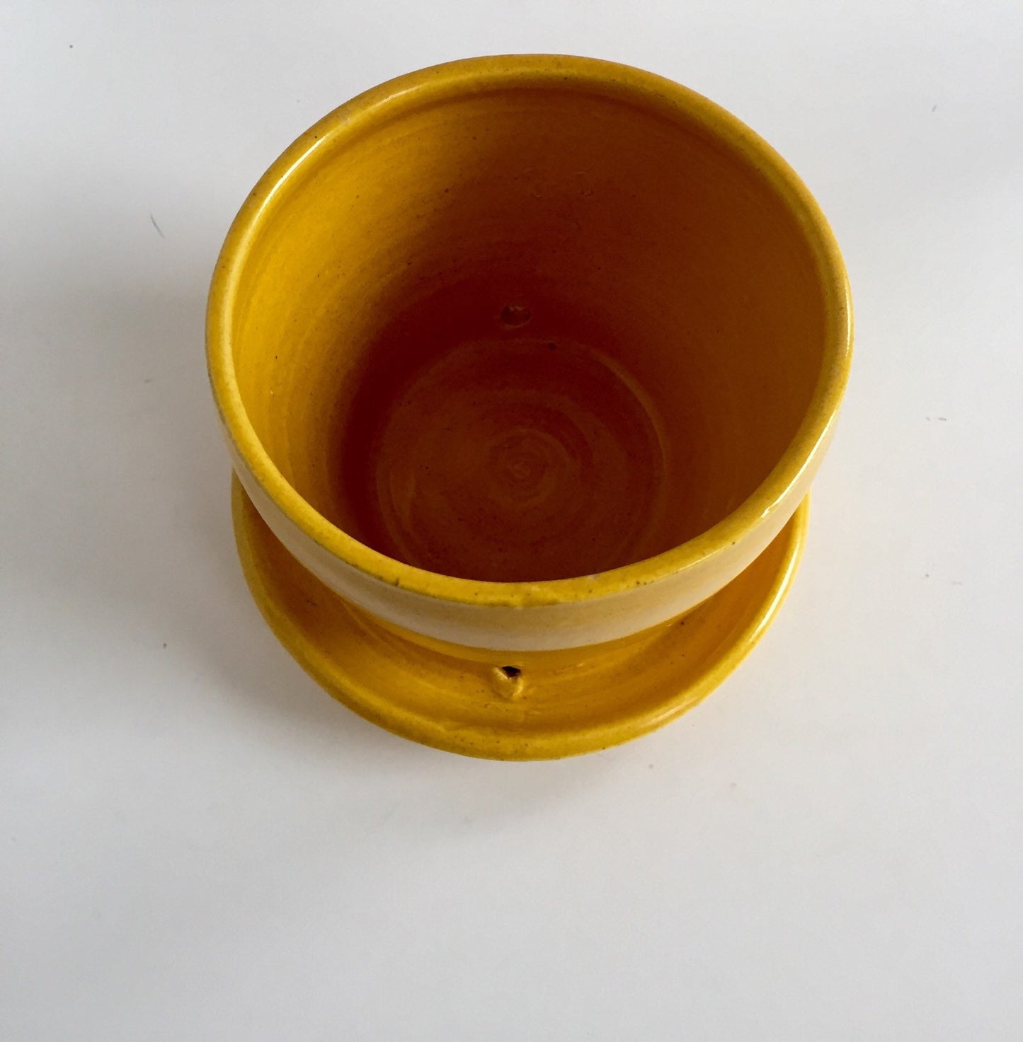 yellow ceramic planter with attached base