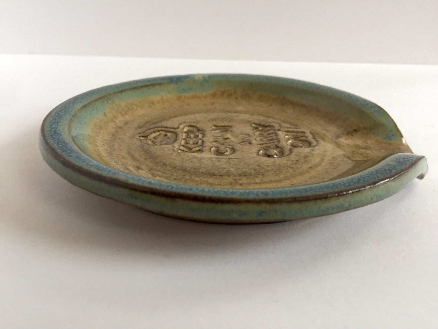 Keep calm and carry on" inspired handmade ceramic spoon rest in almond and teal