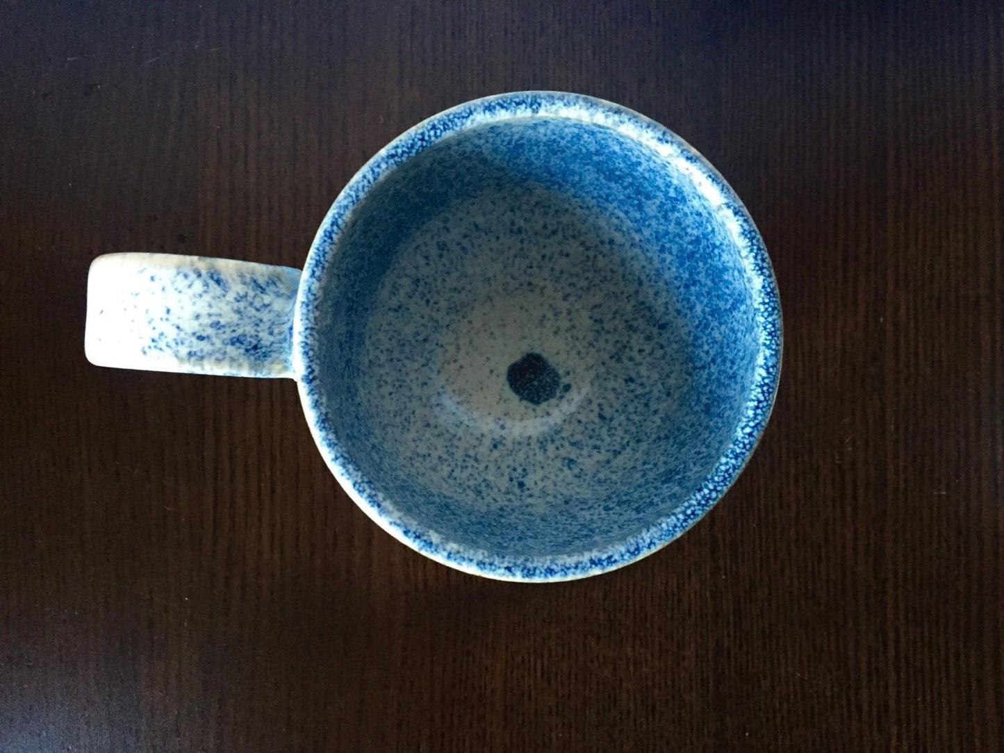 Ceramic coffee mug in white and blue snow fall.
