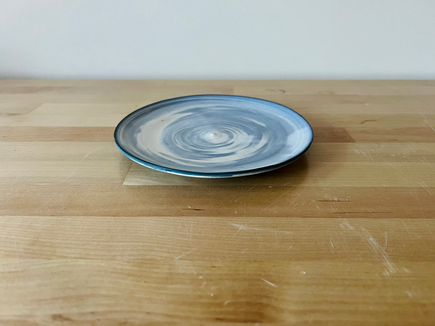 limited edition. plates and blates. mixed and marbled white and blue clay. kitchenware. handmade ceramic