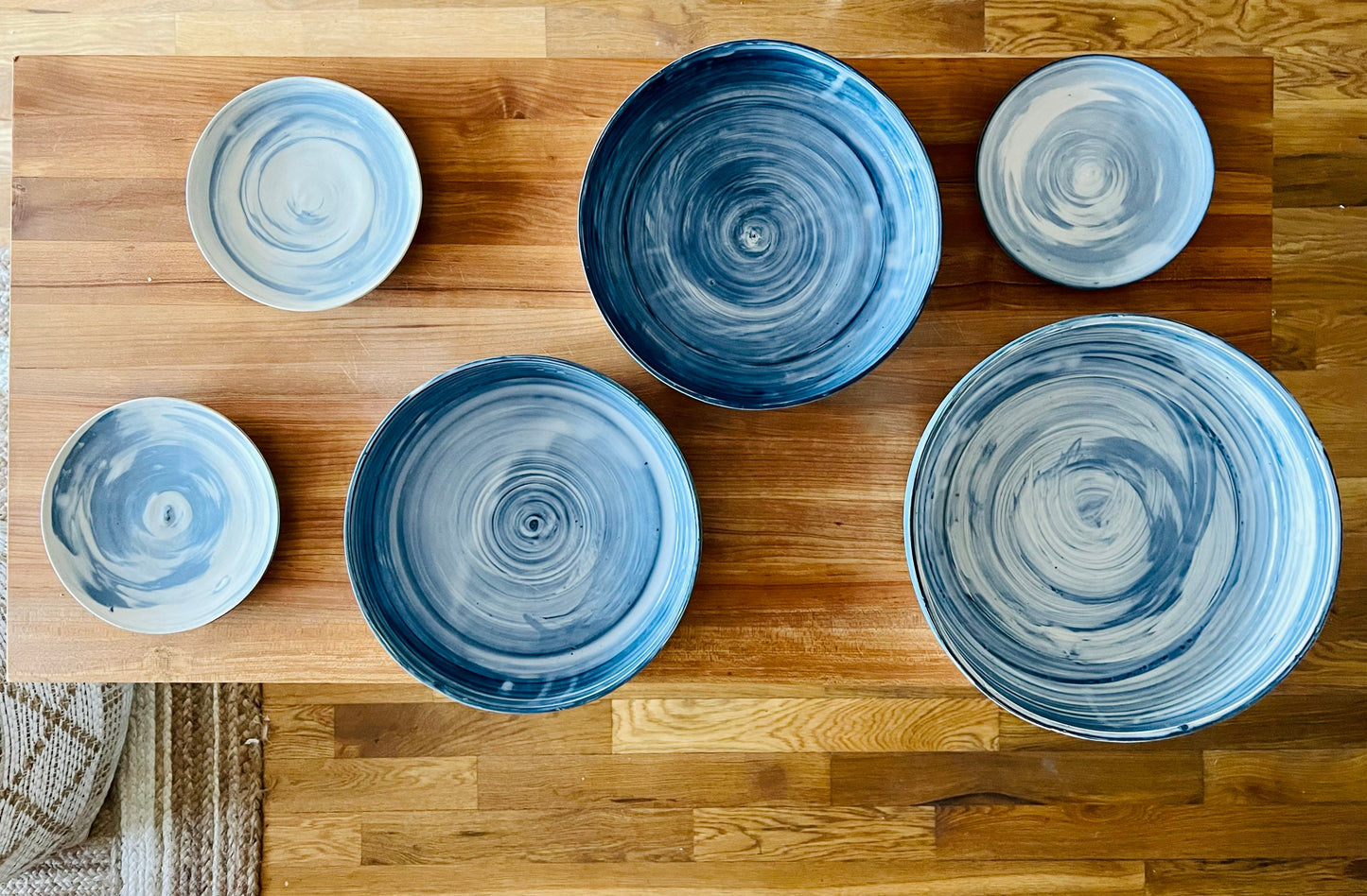 limited edition. plates and blates. mixed and marbled white and blue clay. kitchenware. handmade ceramic