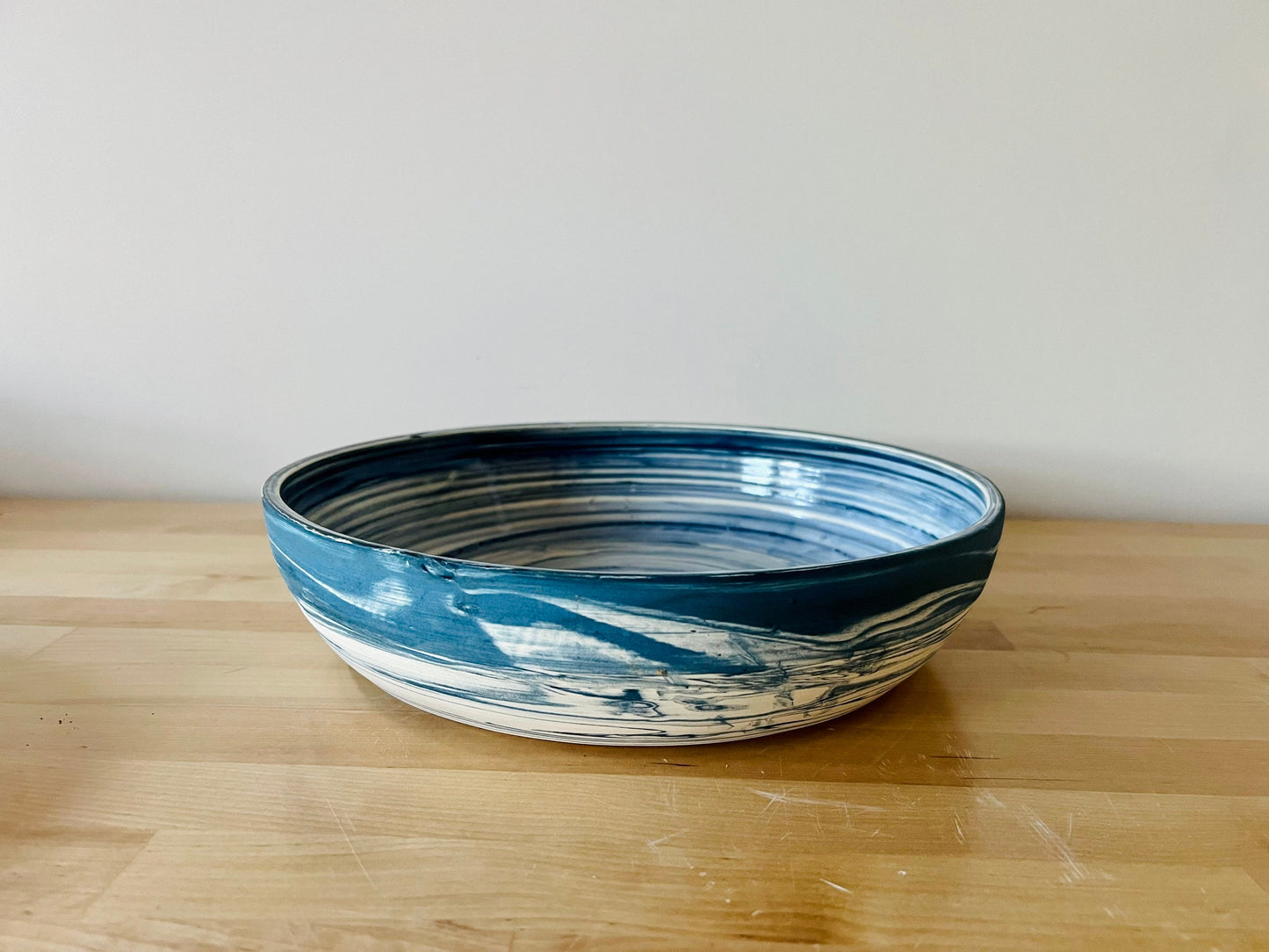 limited edition. plates and blates. mixed and marbled white and blue clay. kitchenware. handmade ceramic