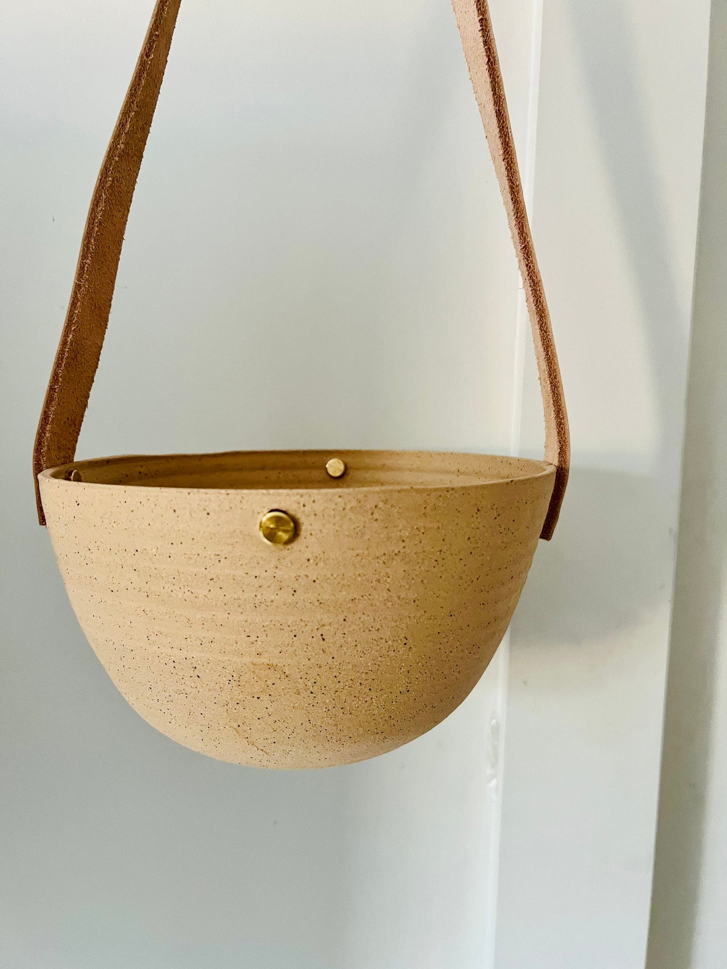 limited edition -western style hanging planter. Natural. leather and brass- Handemade ceramics.