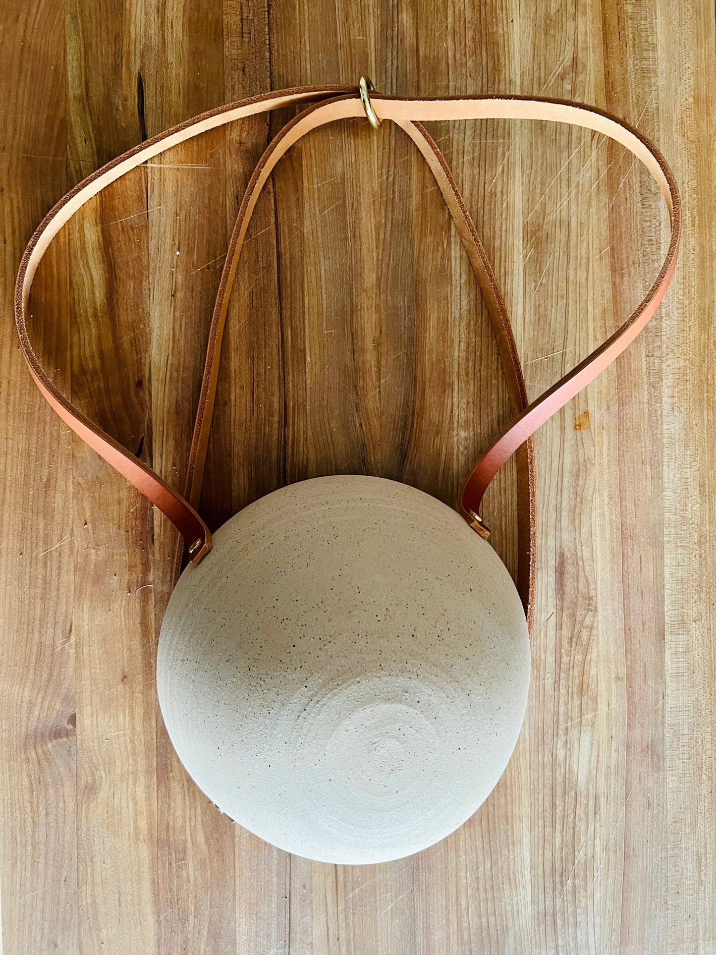 limited edition- western style hanging planter. Natural leather and brass. Handemade ceramics.