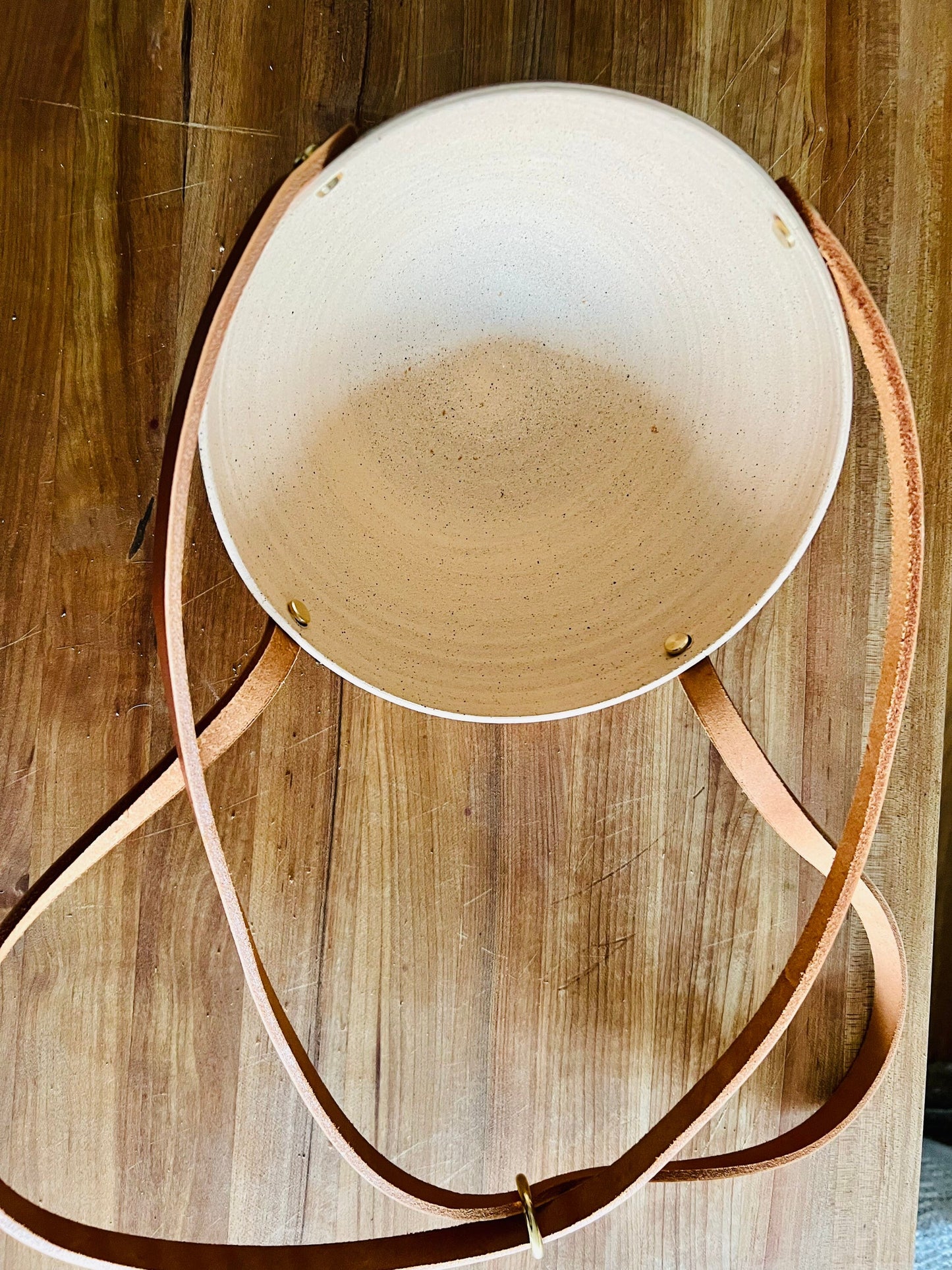 limited edition- western style hanging planter. Natural leather and brass. Handemade ceramics.