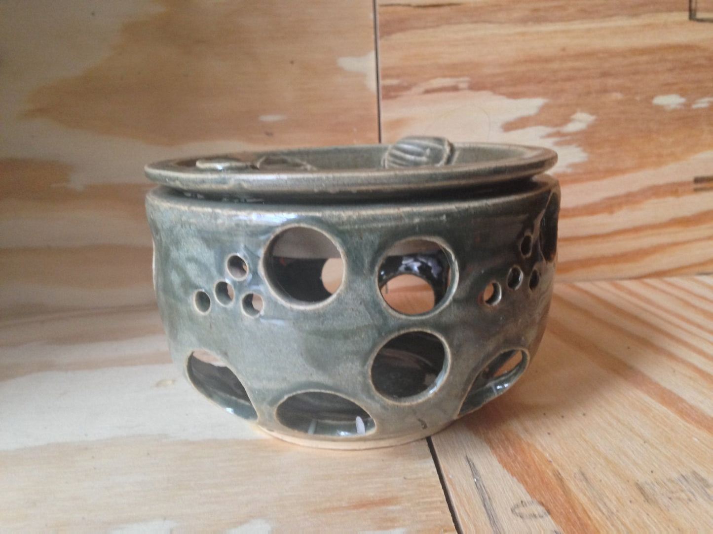 Hunter green scented wax melter with circle design cutout