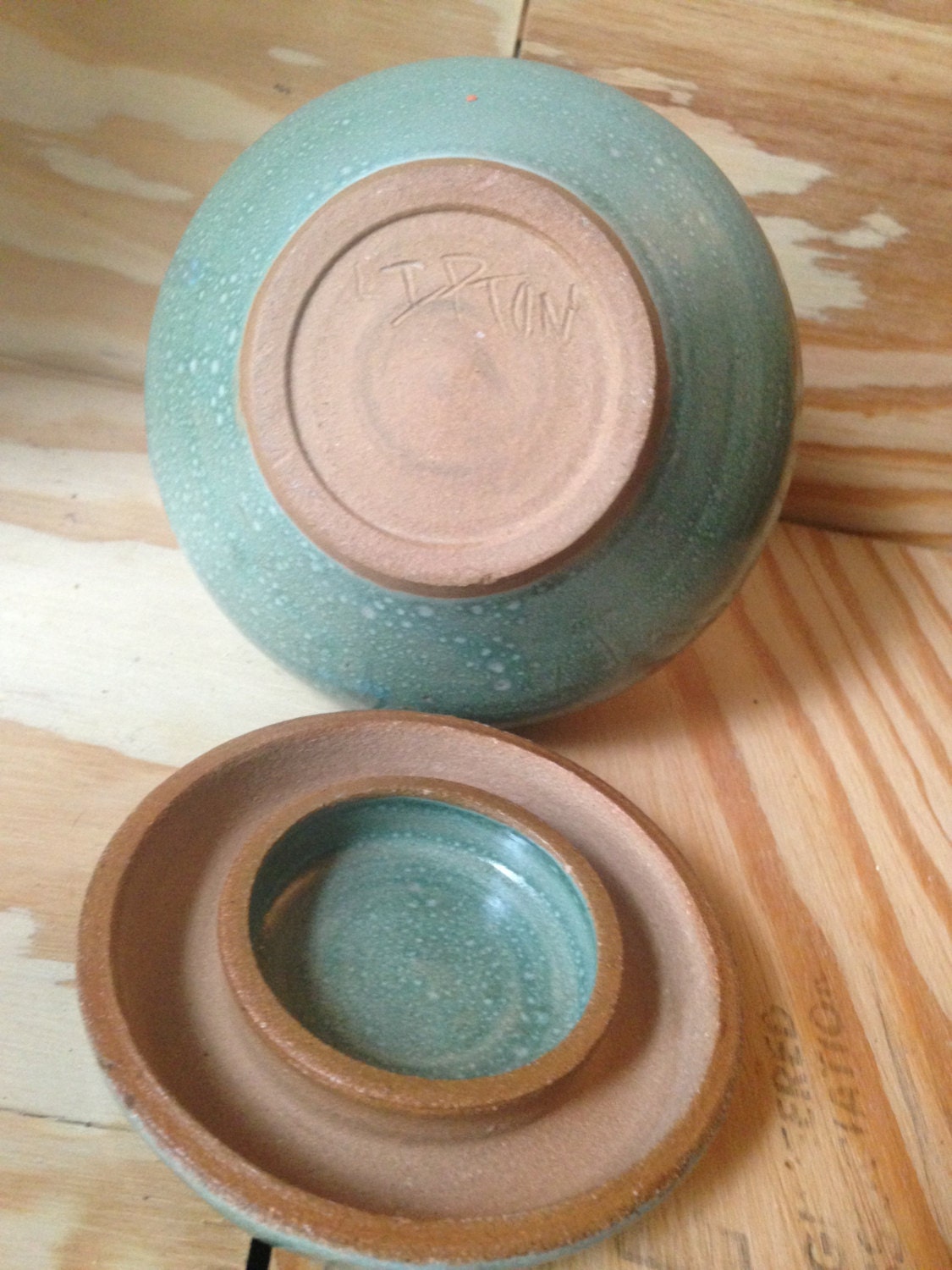 Multipurpose functional hand thrown turquoise lidded jar.