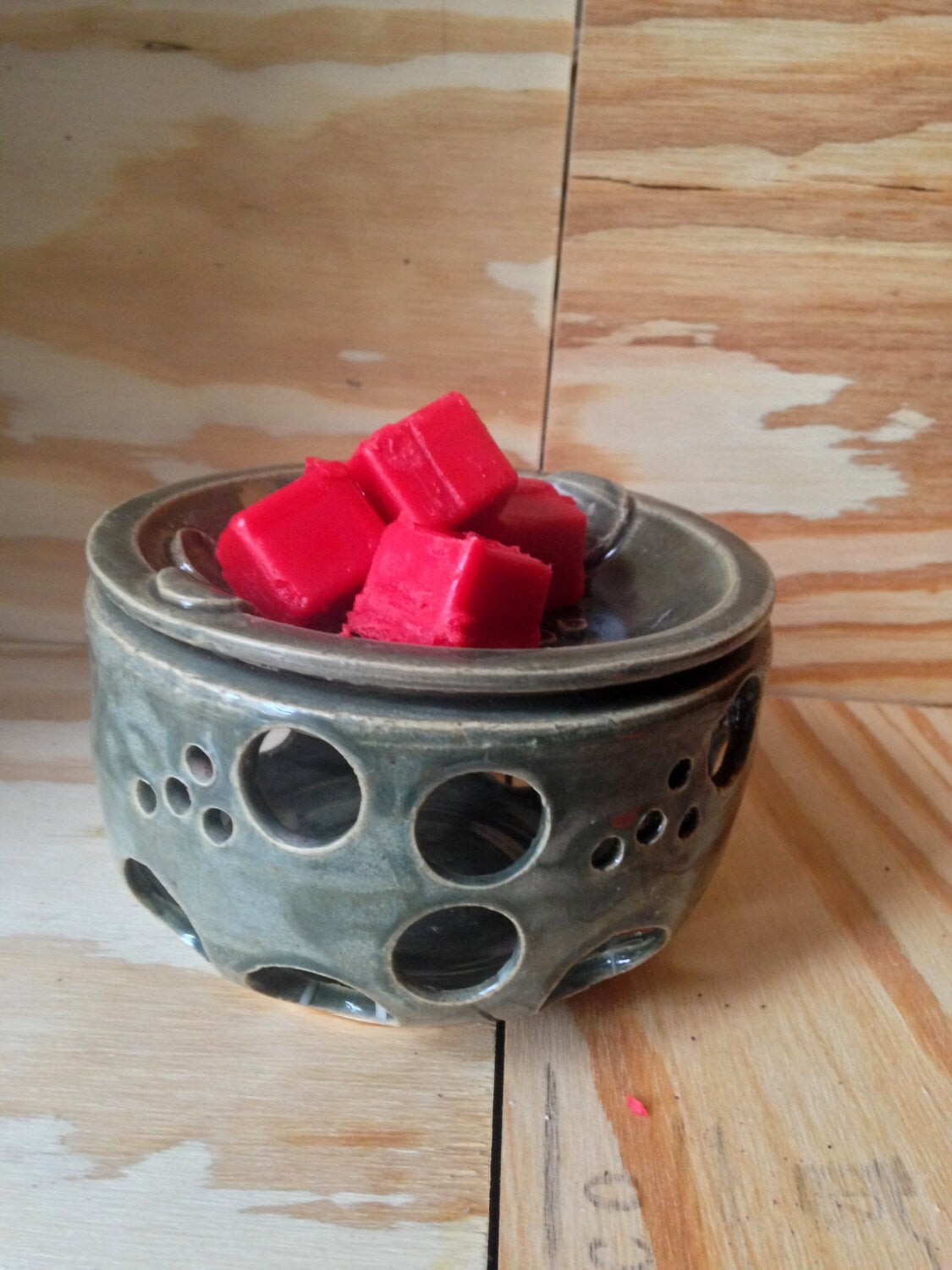 Hunter green scented wax melter with circle design cutout