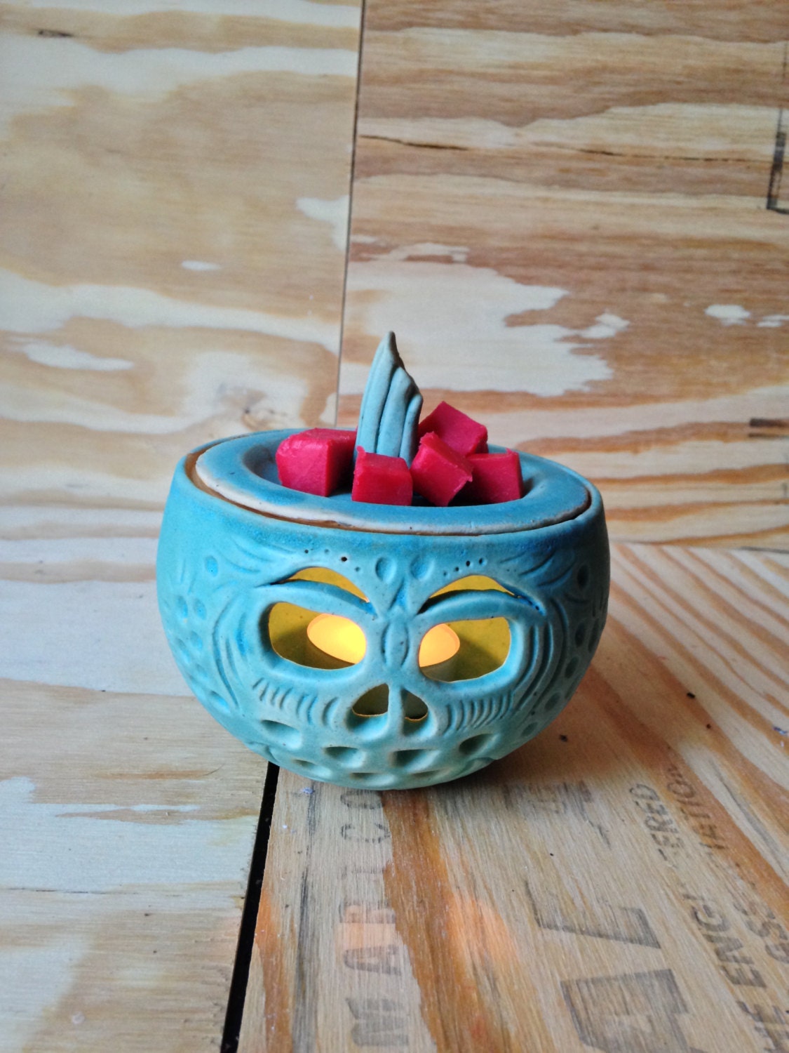unique turqouise scented wax melter jar with hand carved pumpkin design