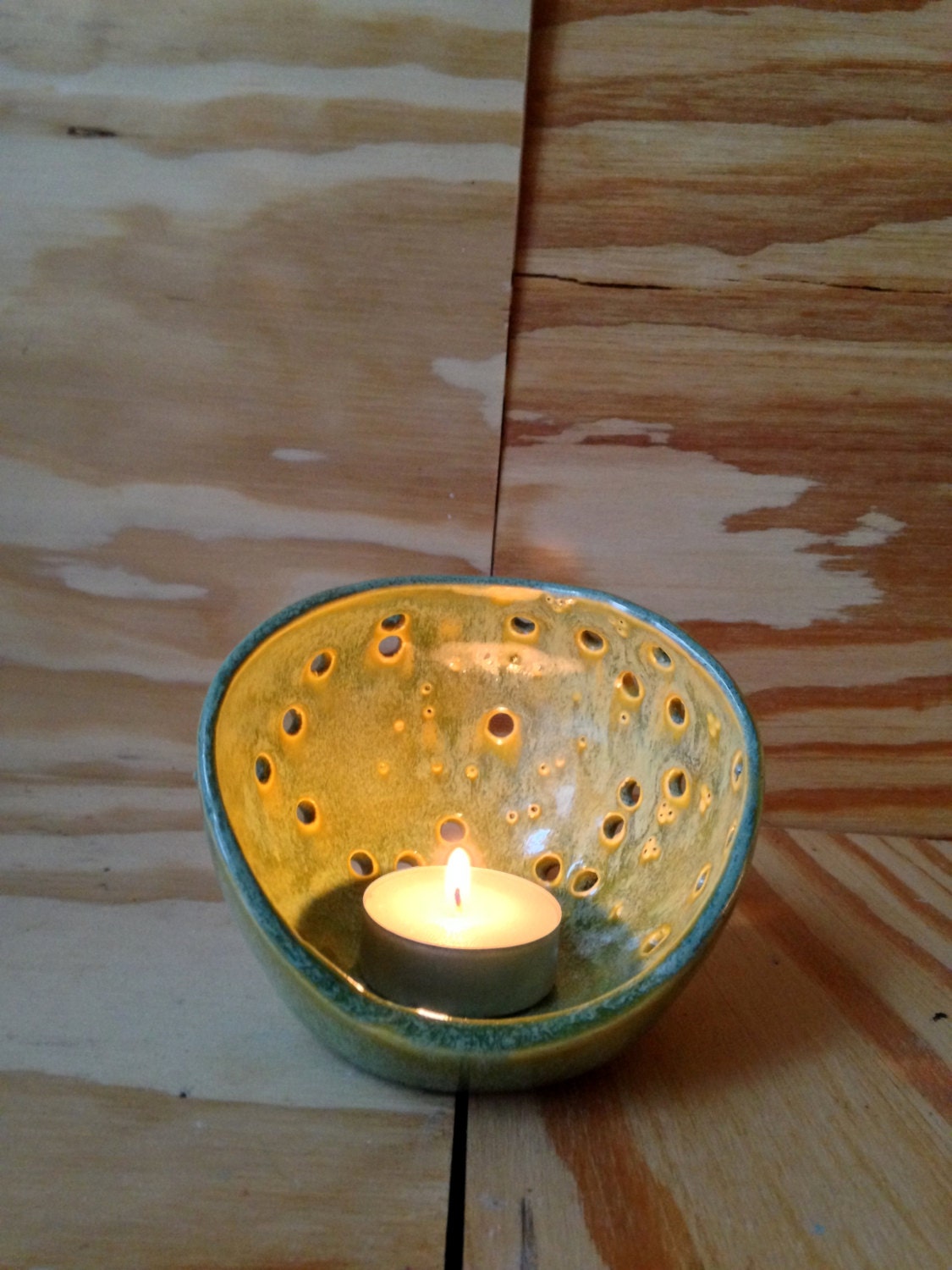 handemade ceramic green candle holder with circle pattern