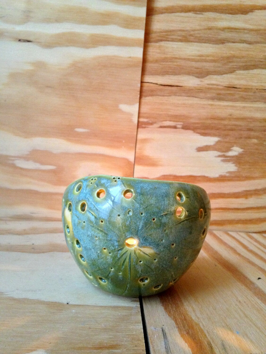 handemade ceramic green candle holder with circle pattern