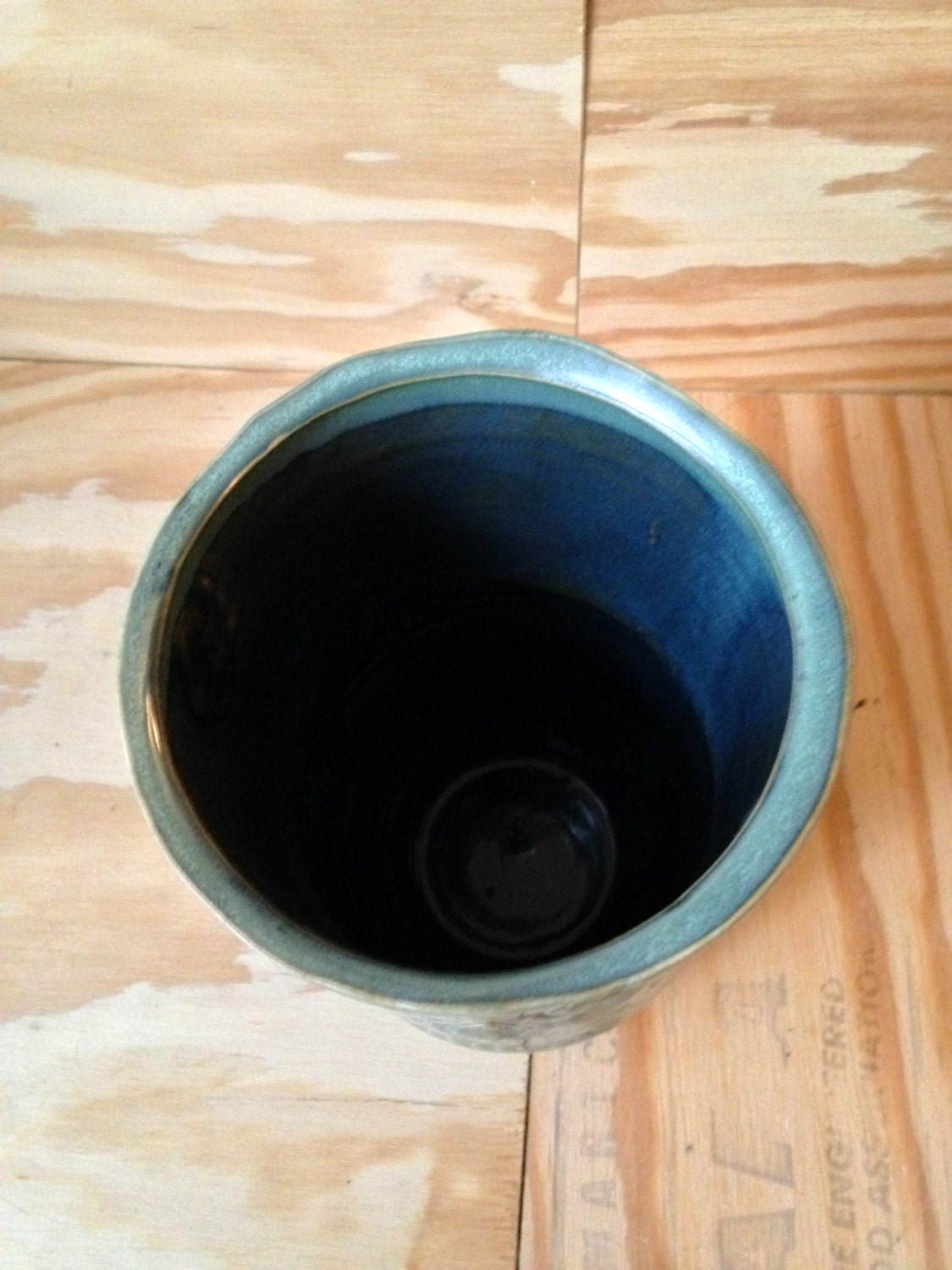 Unique blue green ceramic vase with sugarskull carving