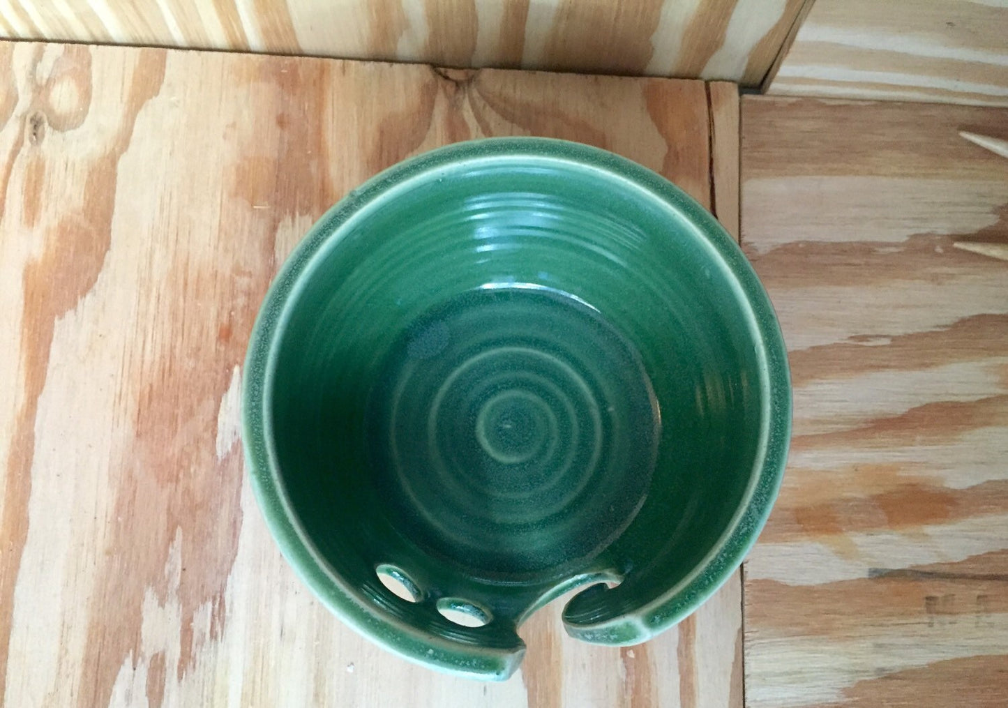Hand crafted green ceramic knitting yarn bowl with hand cut pattern
