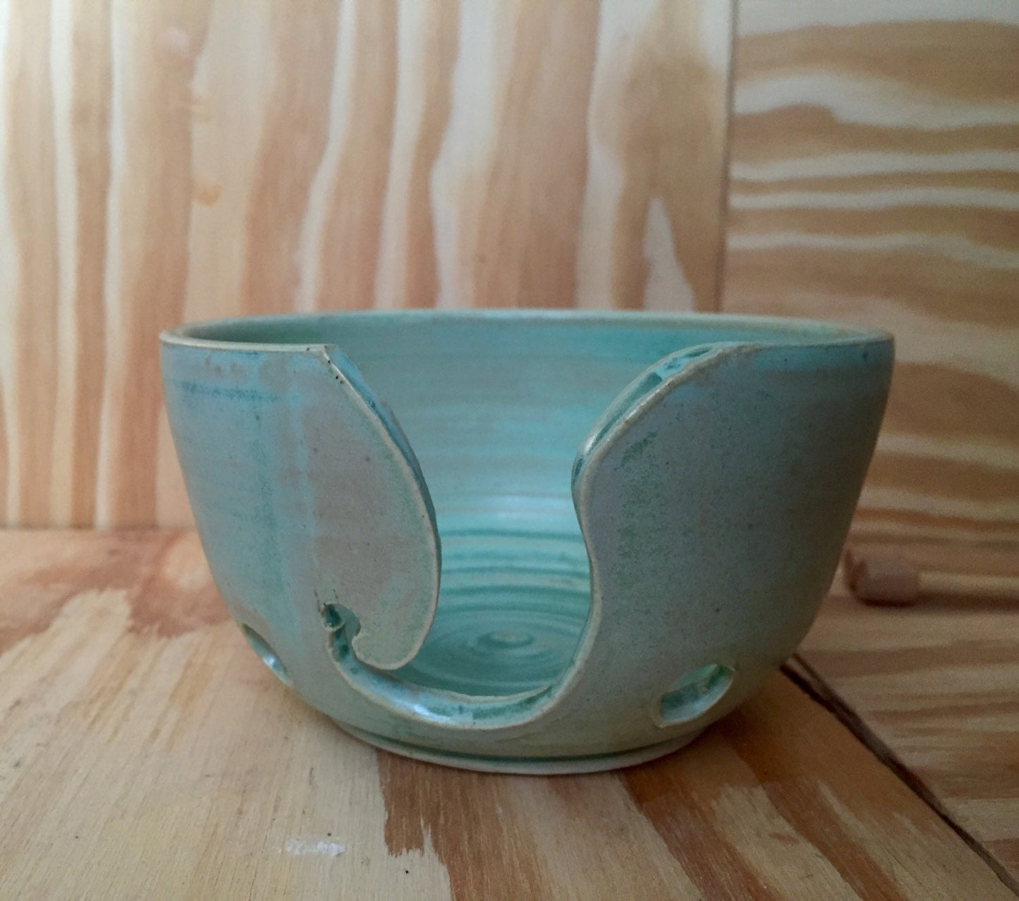 Hand crafted ceramic mint green yarn kitting bowl with hand cut pattern