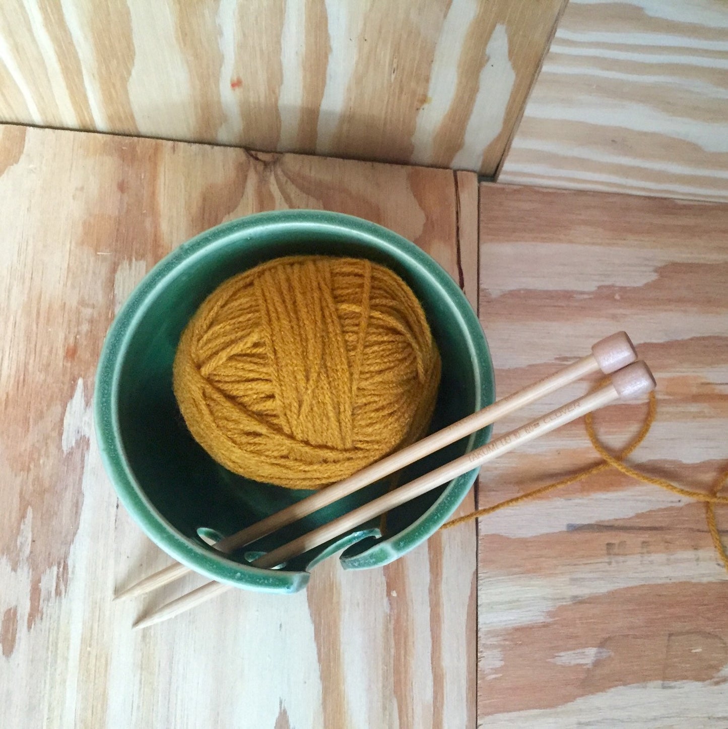 Hand crafted green ceramic knitting yarn bowl with hand cut pattern