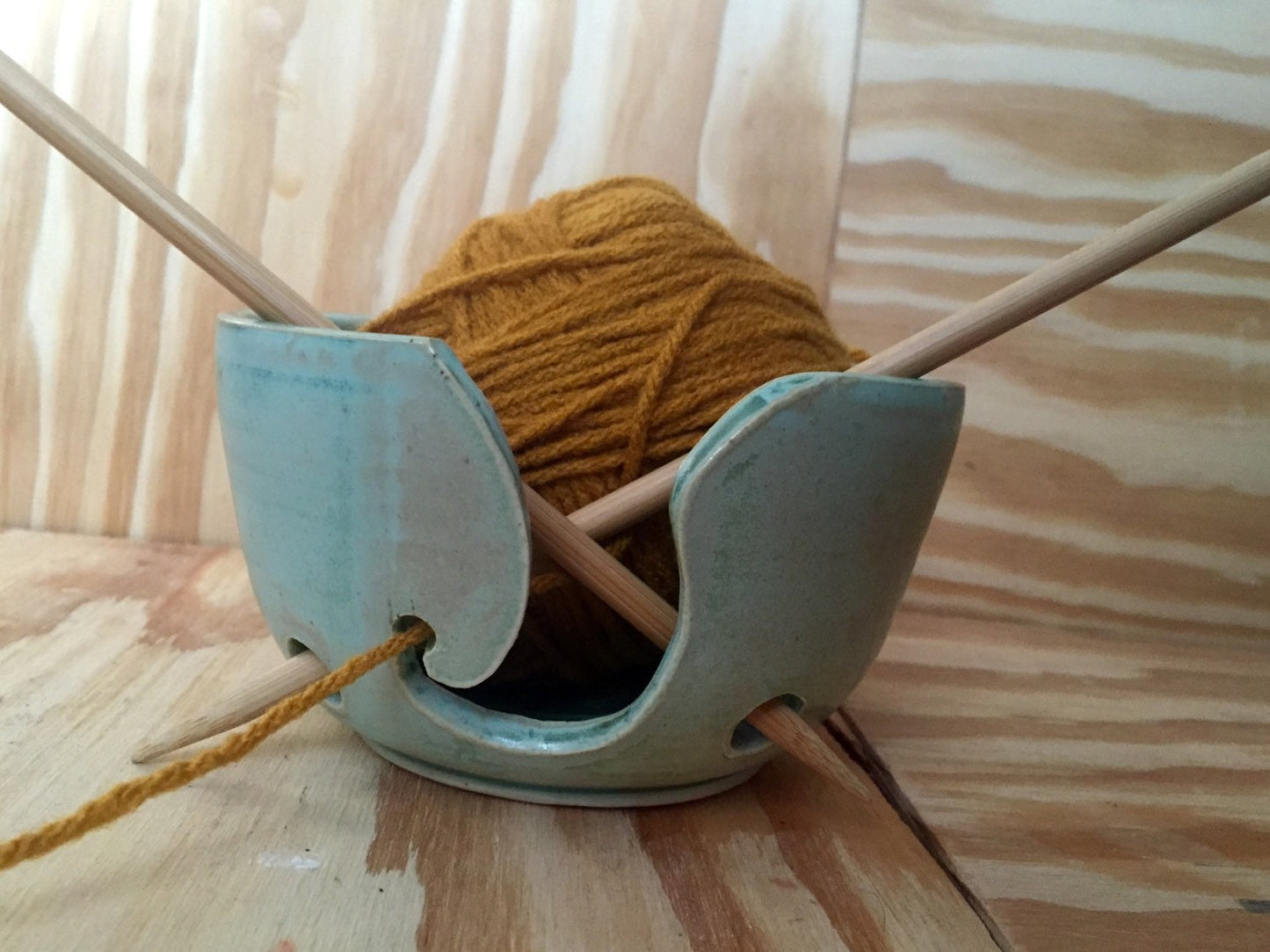 Hand crafted ceramic mint green yarn kitting bowl with hand cut pattern