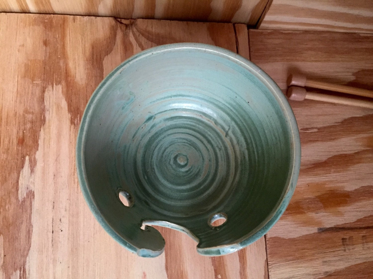 Hand crafted ceramic mint green yarn kitting bowl with hand cut pattern