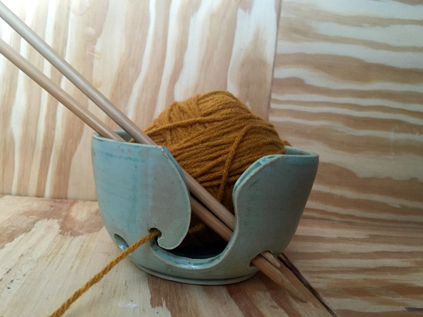 Hand crafted ceramic mint green yarn kitting bowl with hand cut pattern