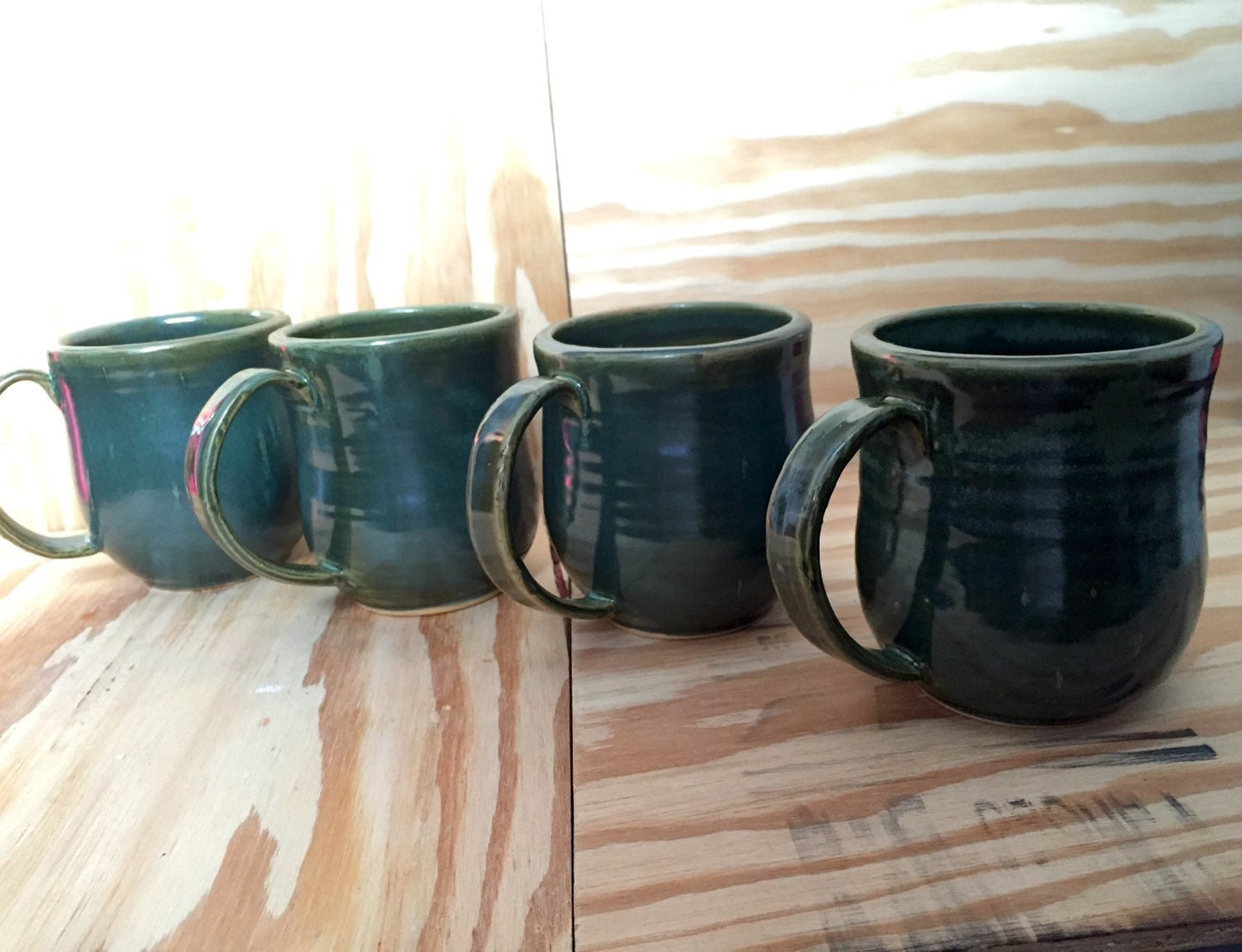 Handmade ceramic mugs in turquoise     Set of four