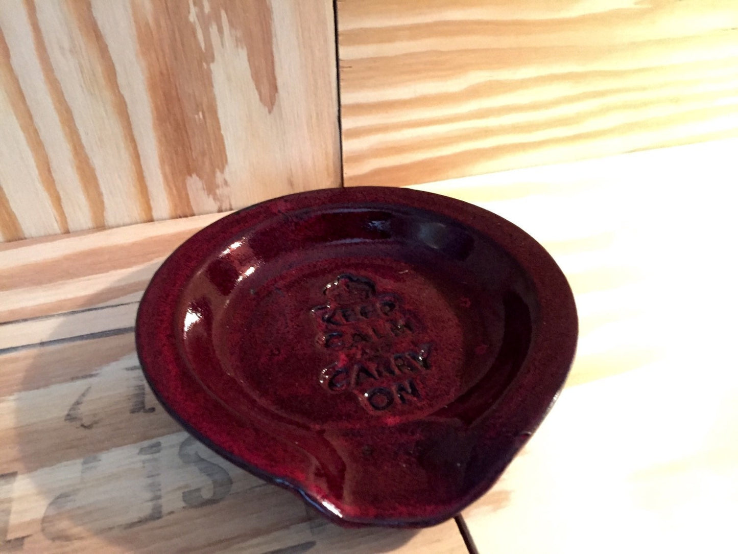 Keep calm and carry on" Handmade ceramic spoon rest in red