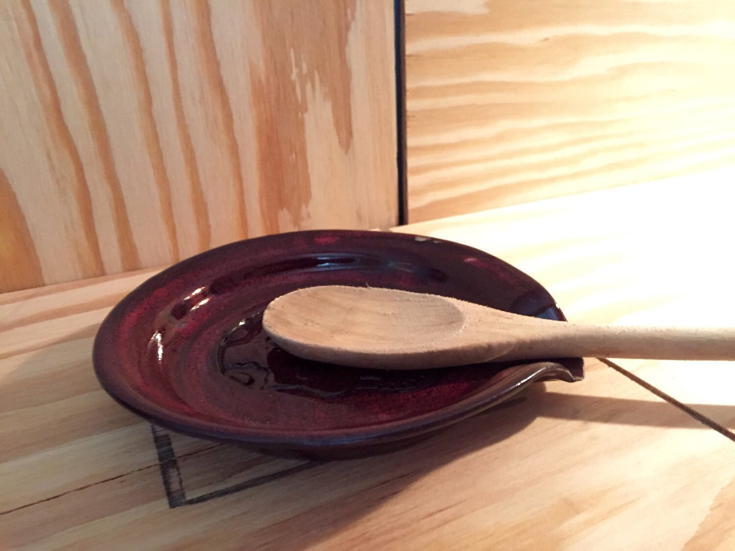 Handmade ceramic spoon rest in red