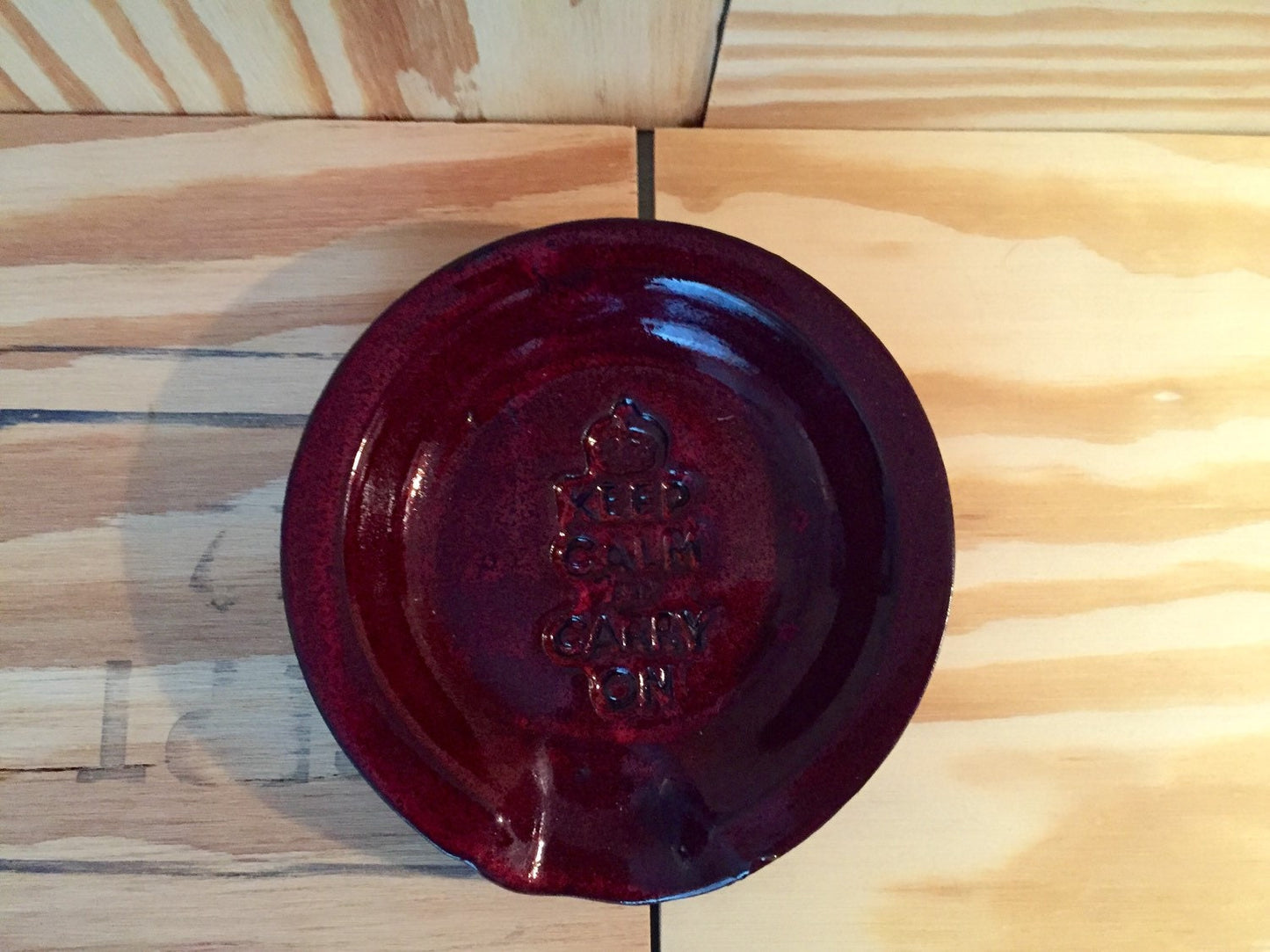 Keep calm and carry on" Handmade ceramic spoon rest in red