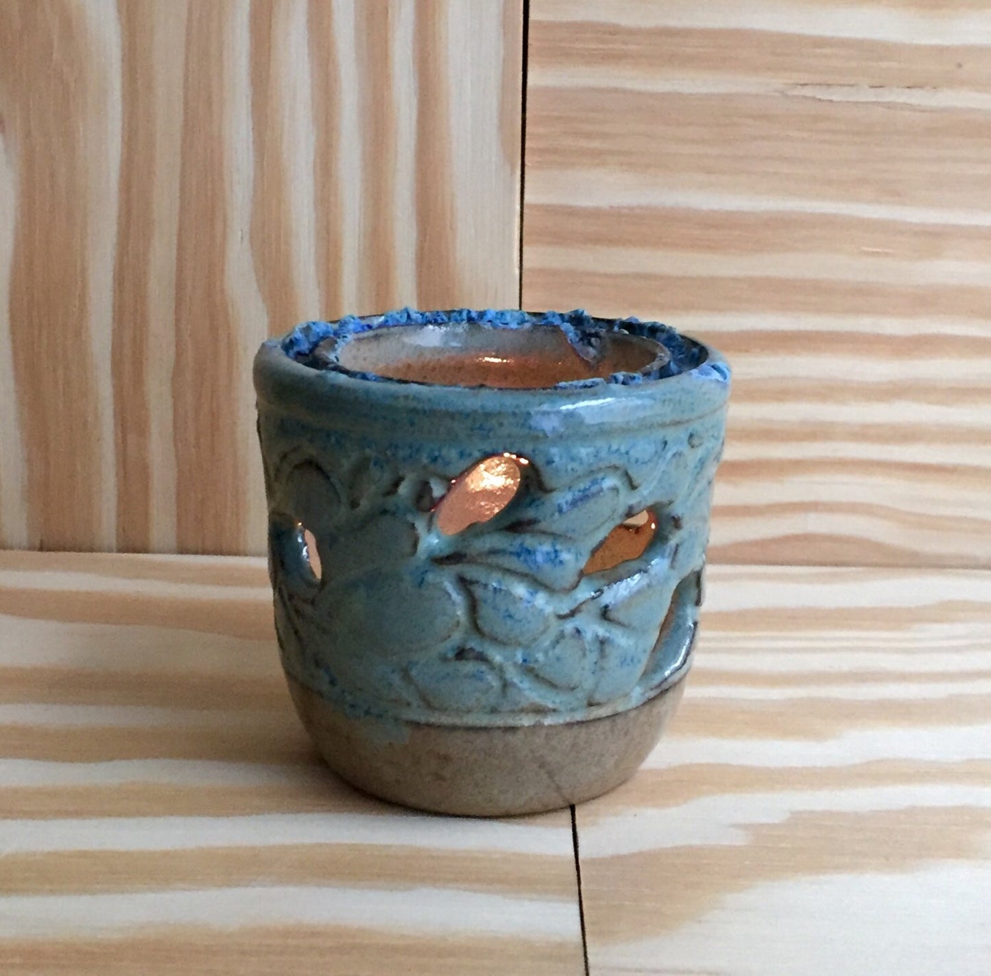 Handemade ceramic candle/tealight holder in blue and almond with melted glass