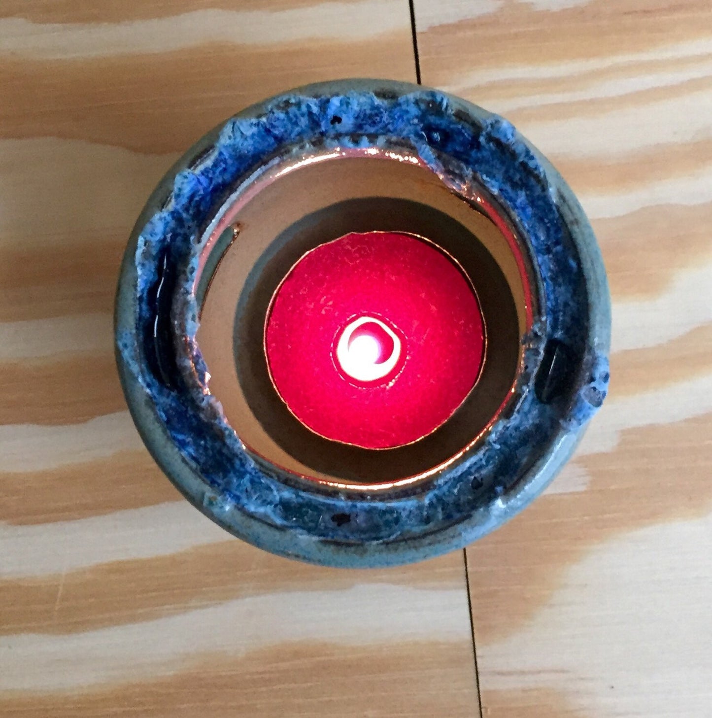 Handemade ceramic candle/tealight holder in blue and almond with melted glass