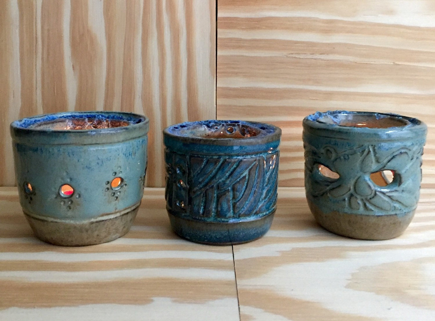 Handemade ceramic candle/tealight holder in blue and almond with melted glass