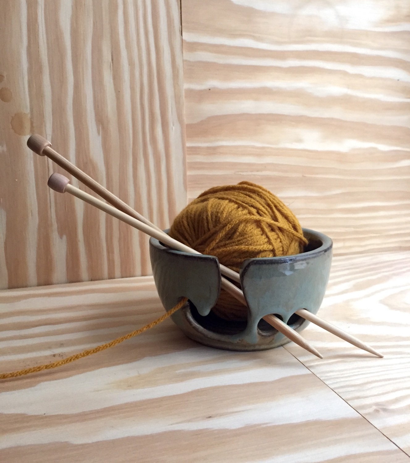 Small Handemade ceramic yarn bowl in almond and blue