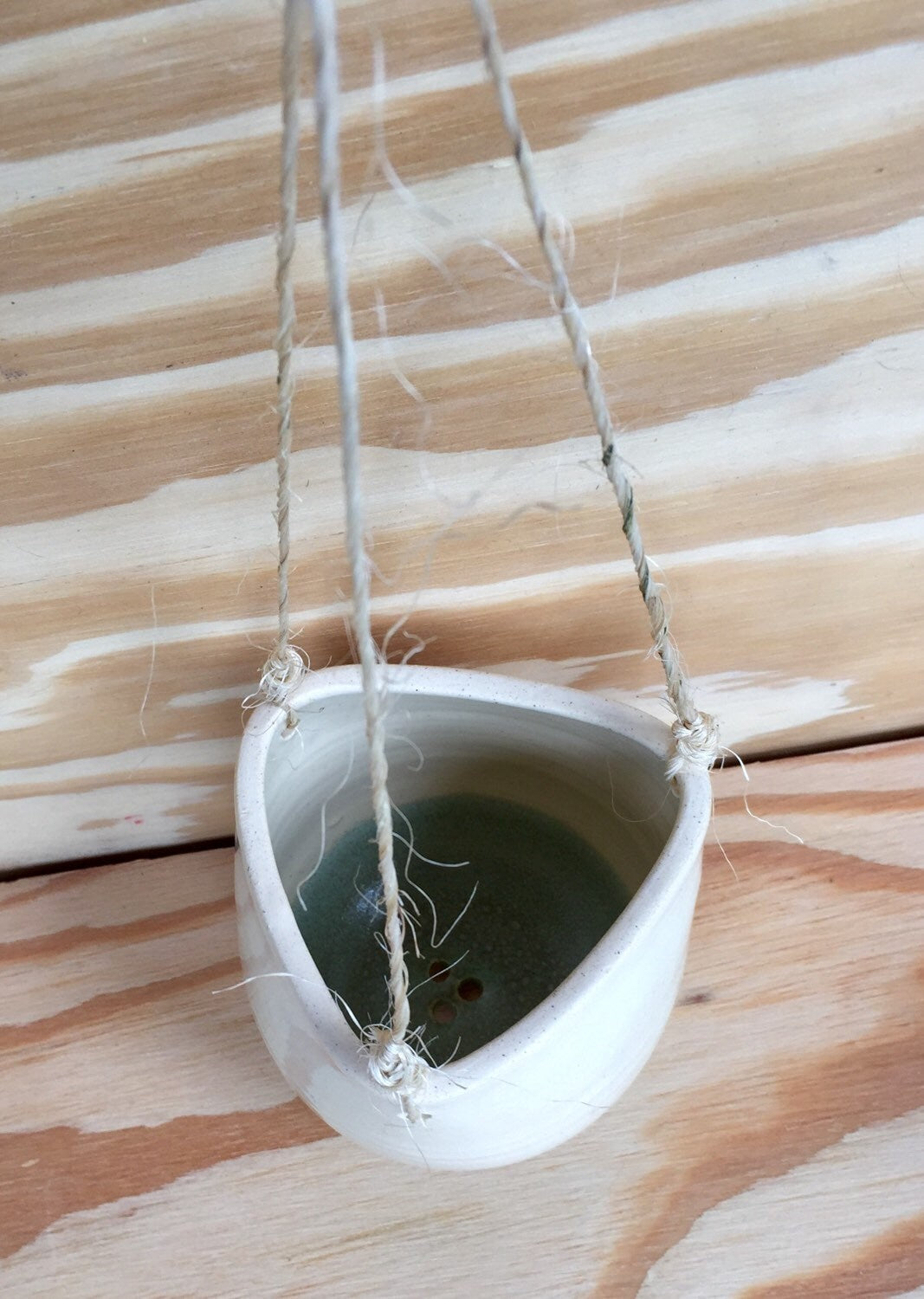 Bright baby blue Ceramic outdoor hanging flower or herb planters in with twine