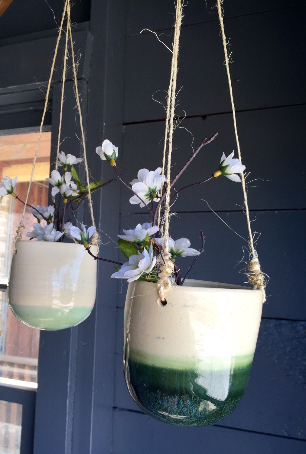 Bright baby blue Ceramic outdoor hanging flower or herb planters in with twine