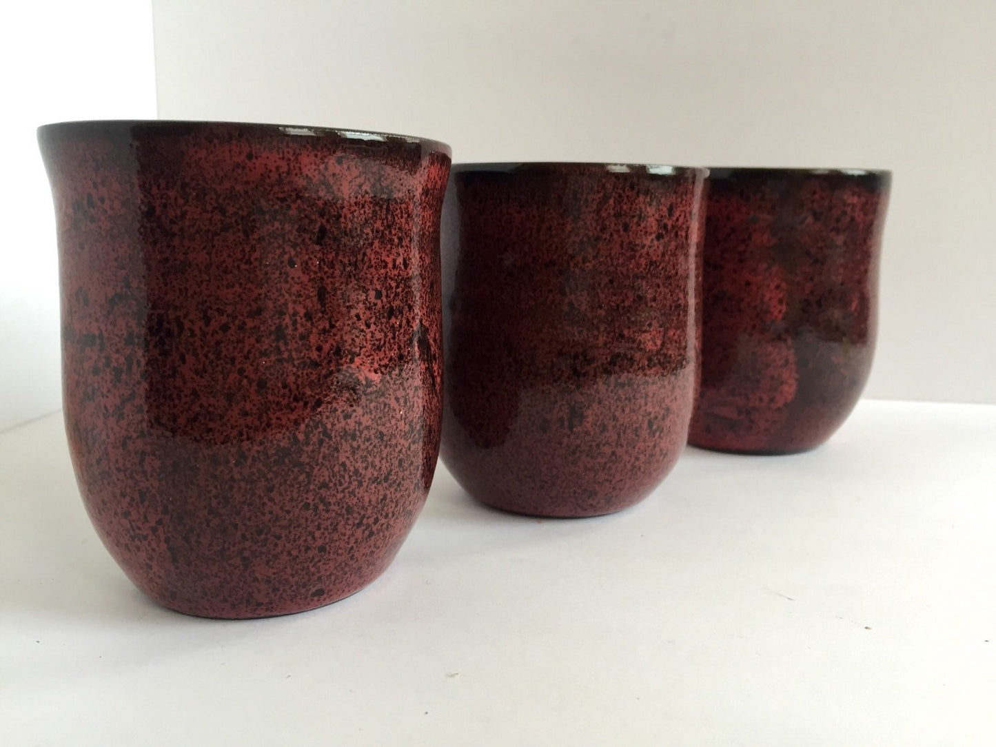 ceramic mug in deep burgandy red