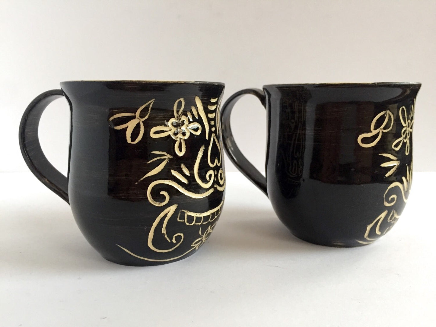 Sugar skull black ceramic coffee mugs with sgrafitto design  set of two.