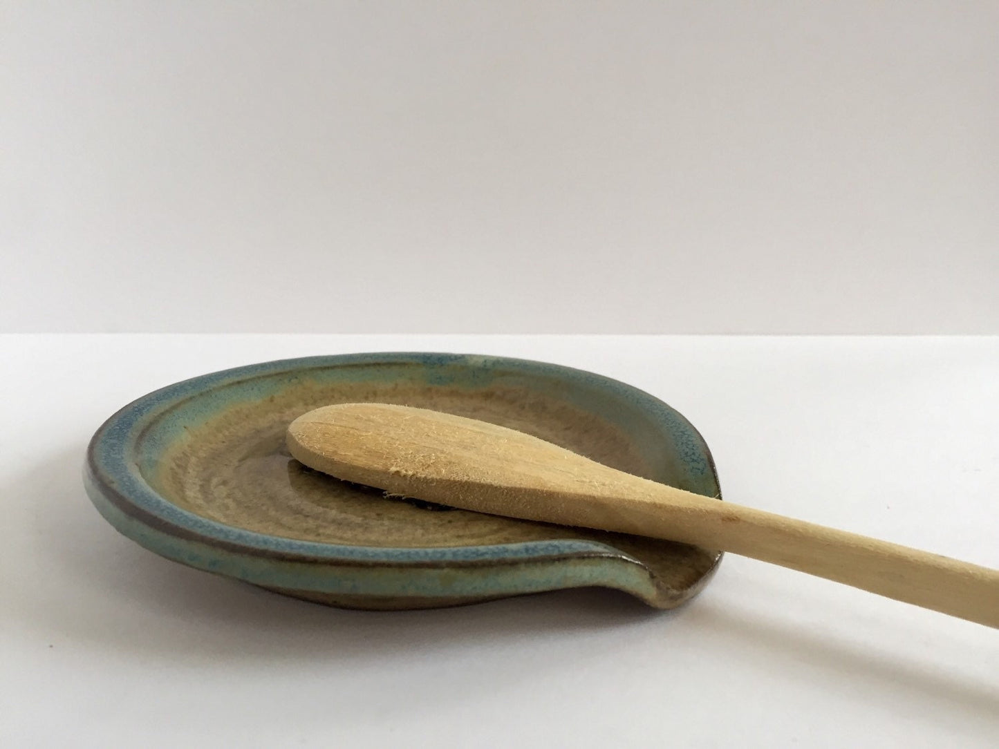 Keep calm and carry on" inspired handmade ceramic spoon rest in almond and teal
