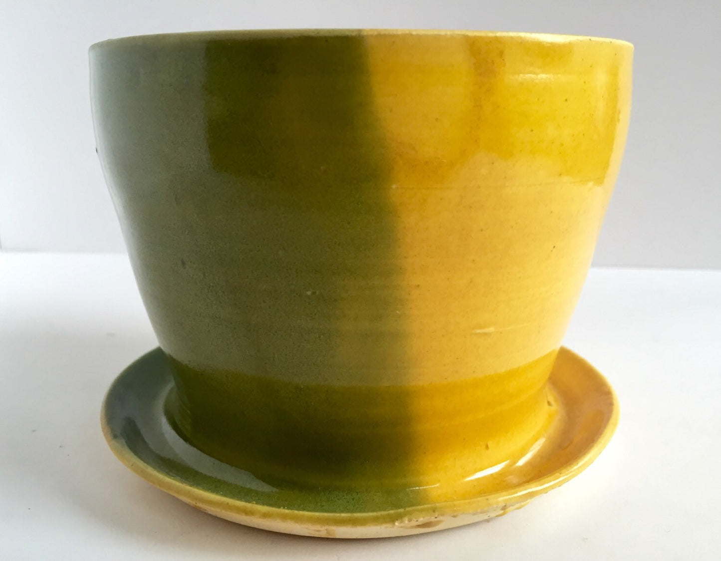 ceramic planter with attached base in green yellow and white