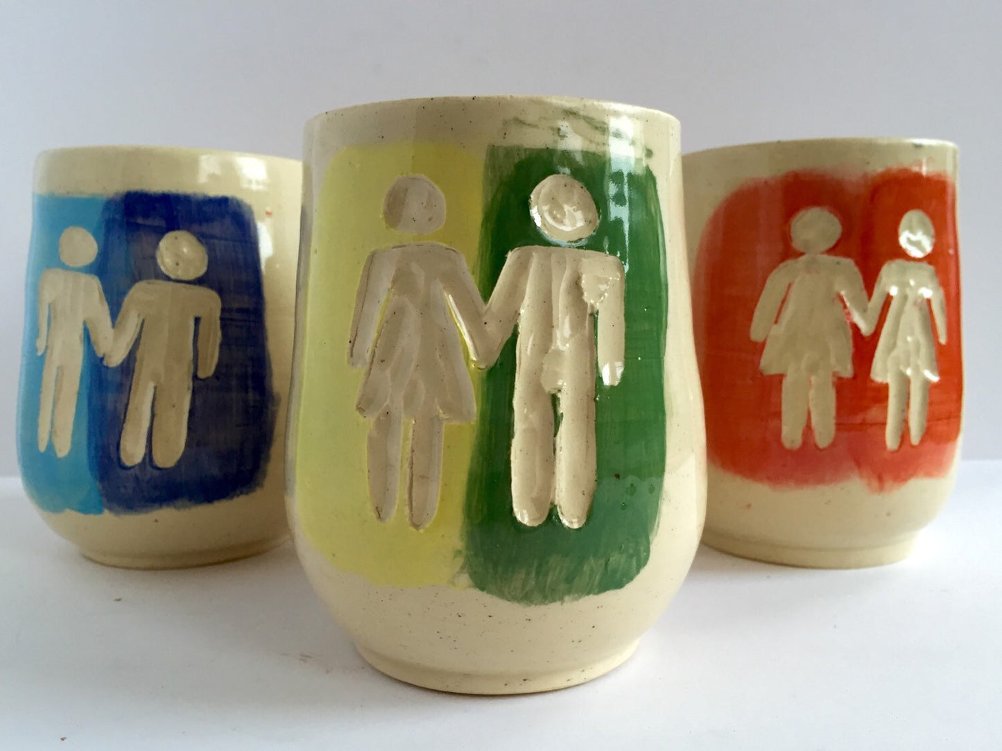 Ceramic tumbler with gay pride inspired design