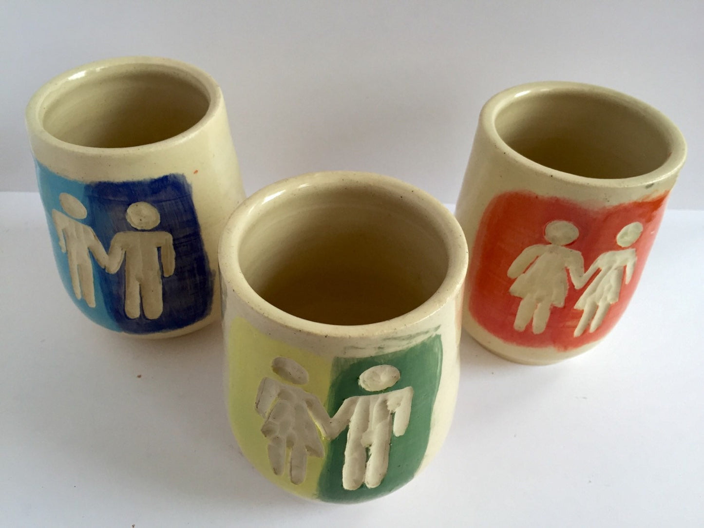 Ceramic tumbler with gay pride inspired design
