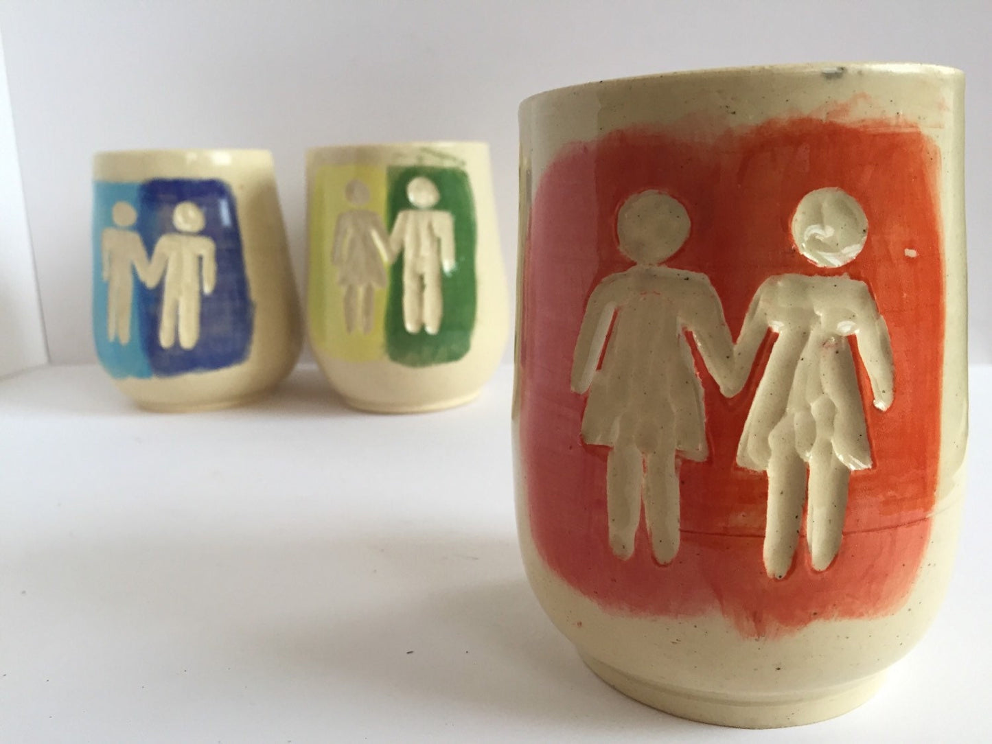 Ceramic tumbler with gay pride inspired design