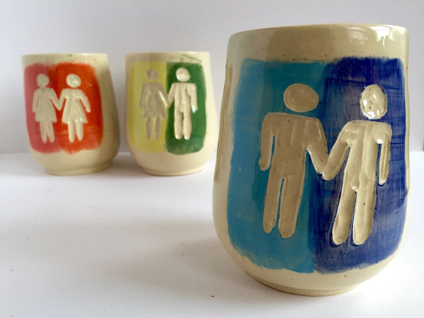 Ceramic tumbler with gay pride inspired design