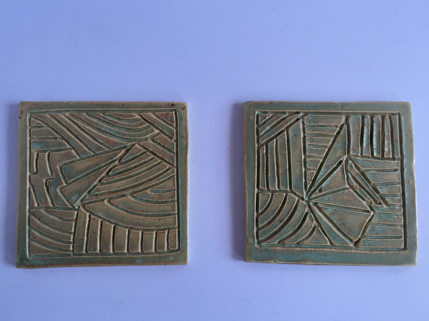 ceramic green coaster set of two with hand carved design