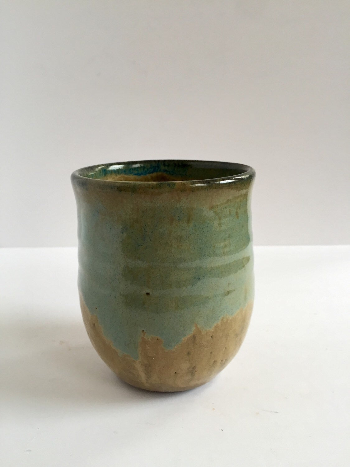 ceramic mug in almond and blue