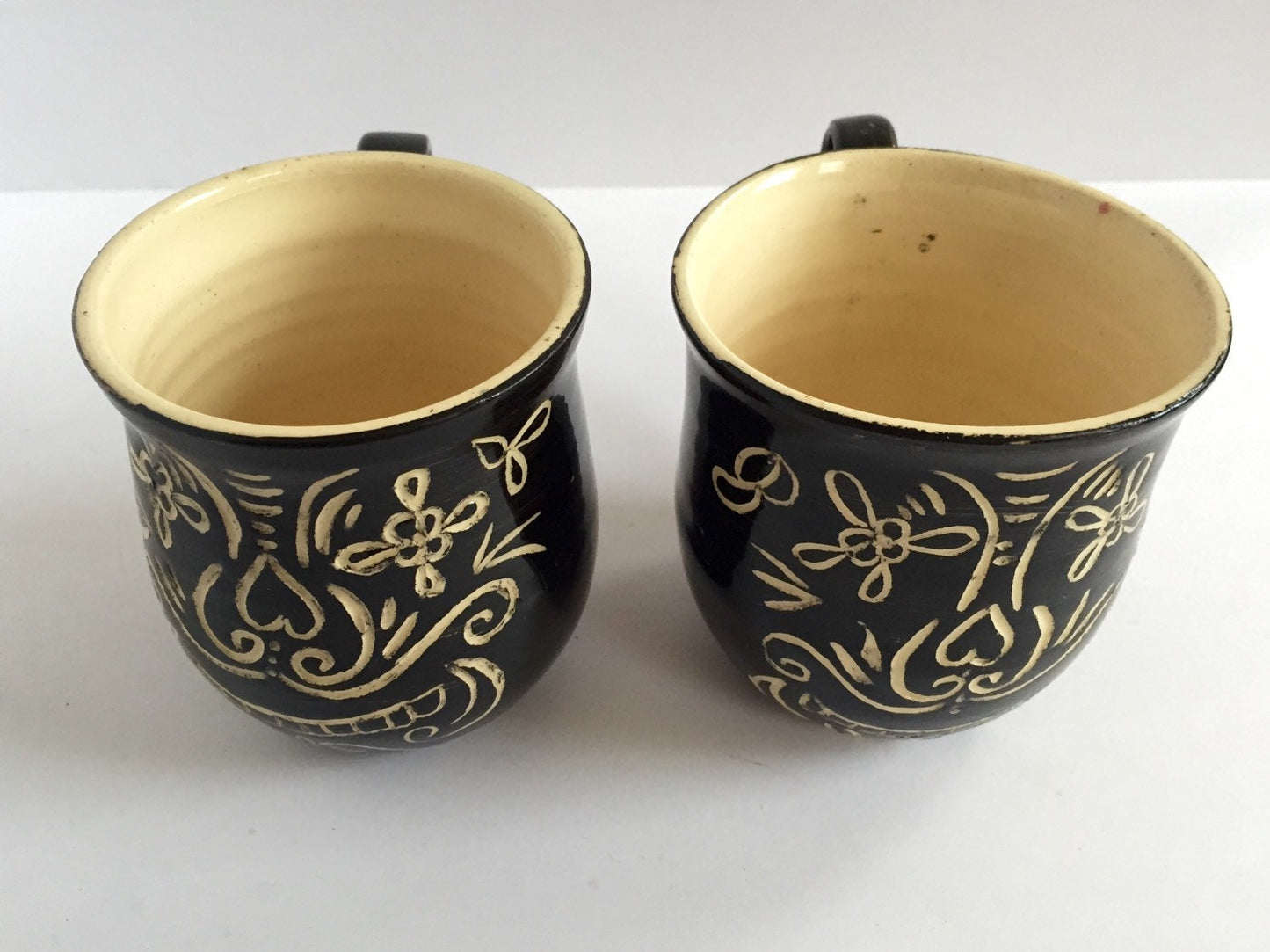 Sugar skull black ceramic coffee mugs with sgrafitto design  set of two.
